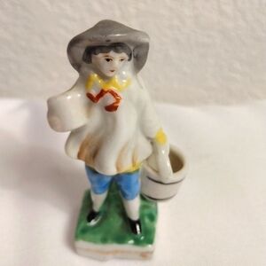 Vintage miniature porcelain figurine of woman carrying bucket/cup & hat & dress
